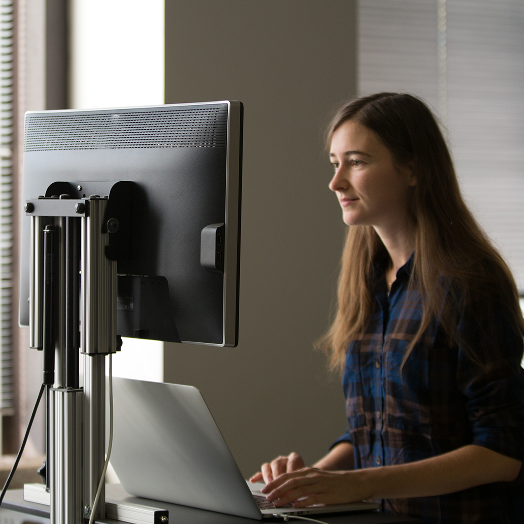 Woman in front of a computer monitor